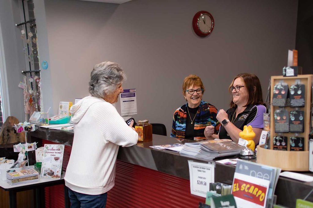 Women standing at reception counter